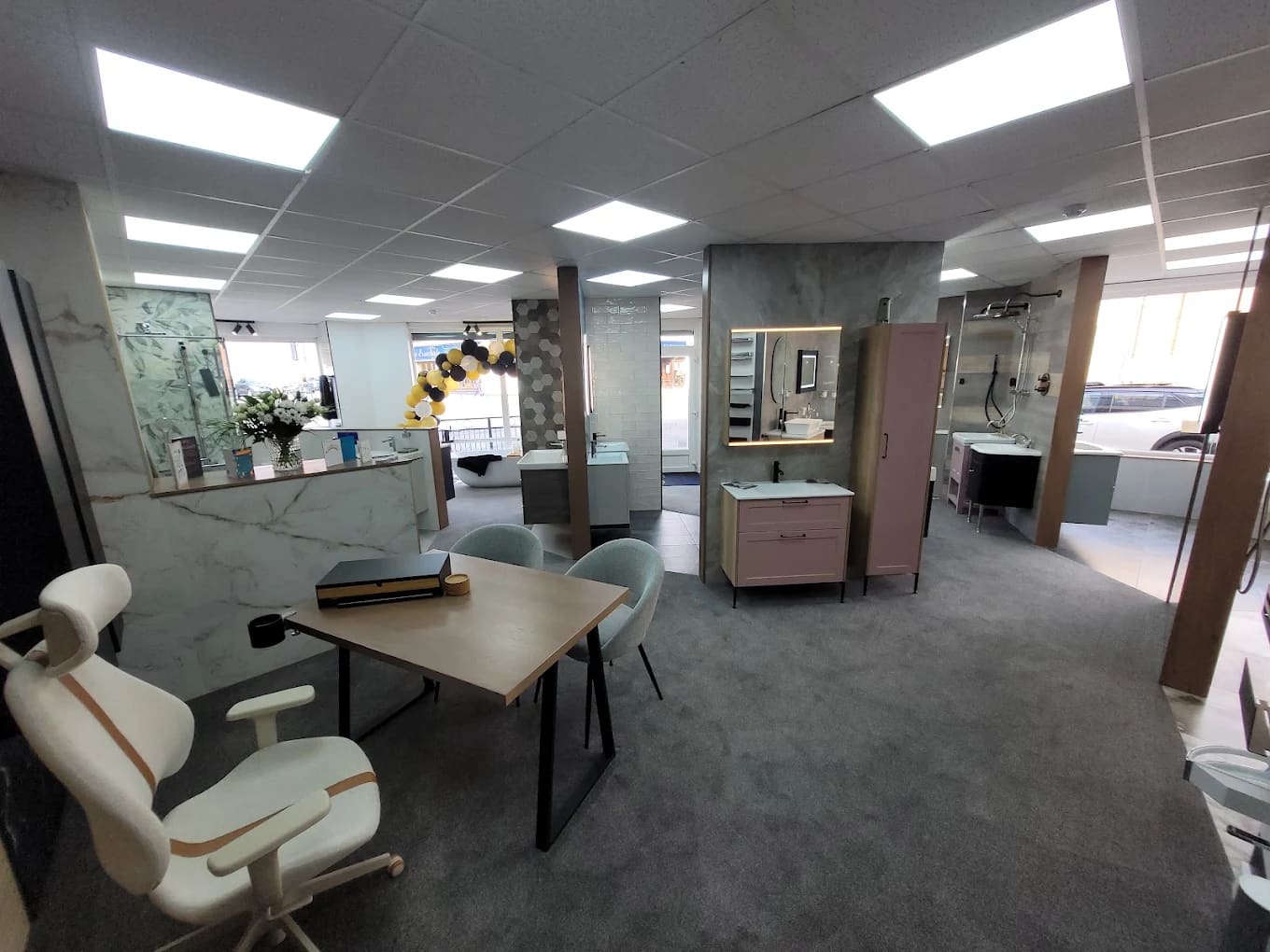 Inside the Goldswan showroom with bathroom displays and the consultation table